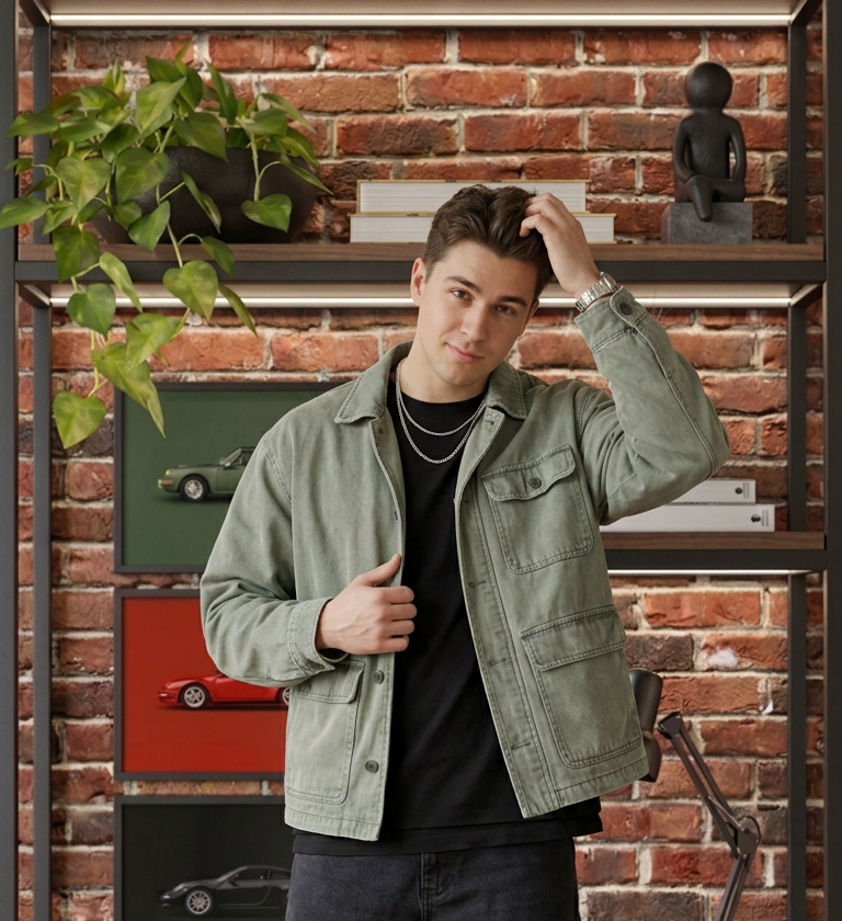 A young content creator filming a vertical Reel in front of the QuickStudio Auto Creator backdrop