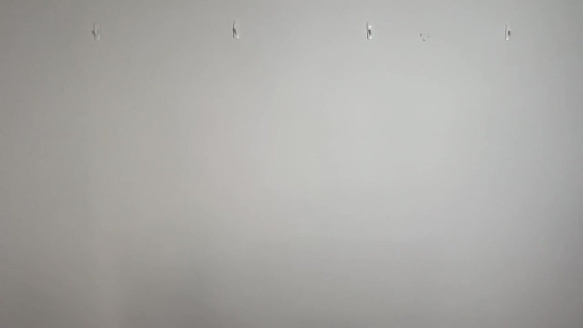 Blank wall ready for a QuickStudio physical fabric backdrop to be installed